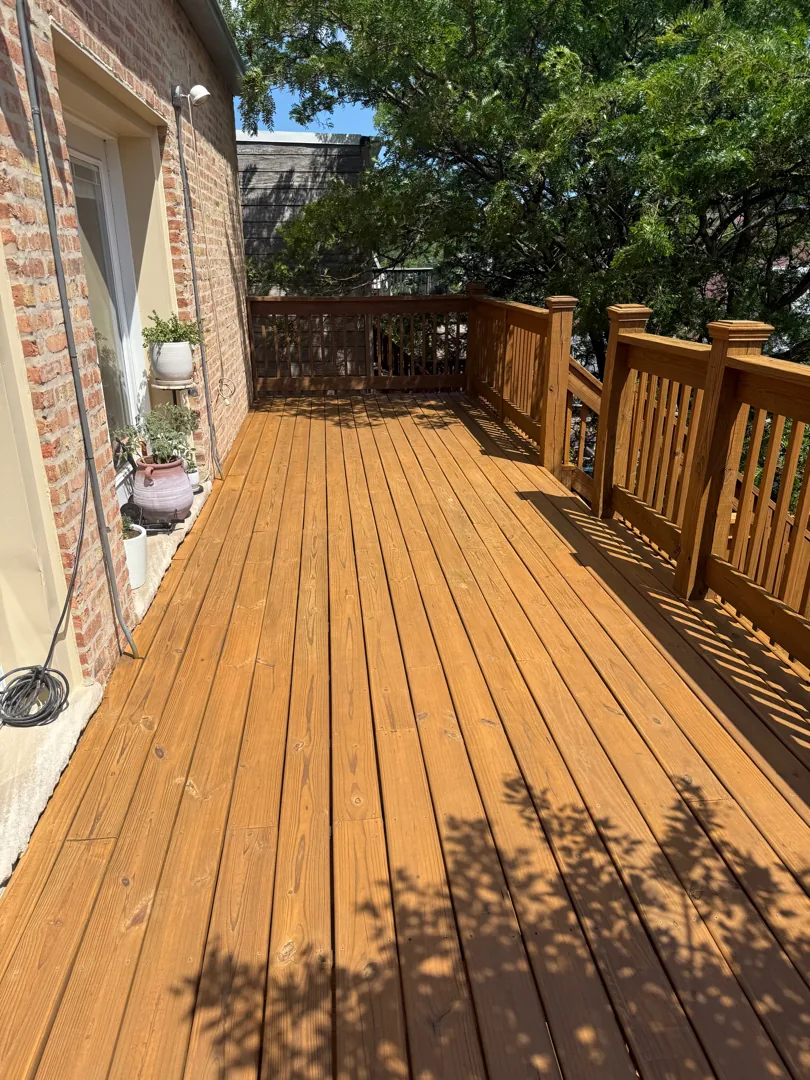 Finished wood porch deck on a Chicago three-flat after cleaning and a penetrating stain
