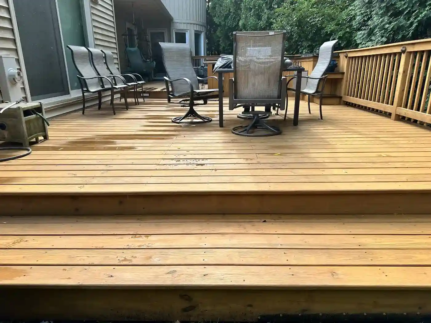 Weathered Chicago wood deck being cleaned and restored, showing why professional deck maintenance matters
