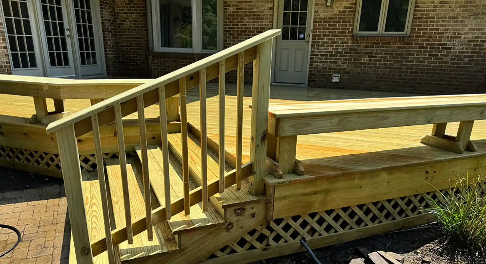 Professional outdoor deck services in Chicago — a freshly built and stained wood deck with railing and stairs by Deck Doc