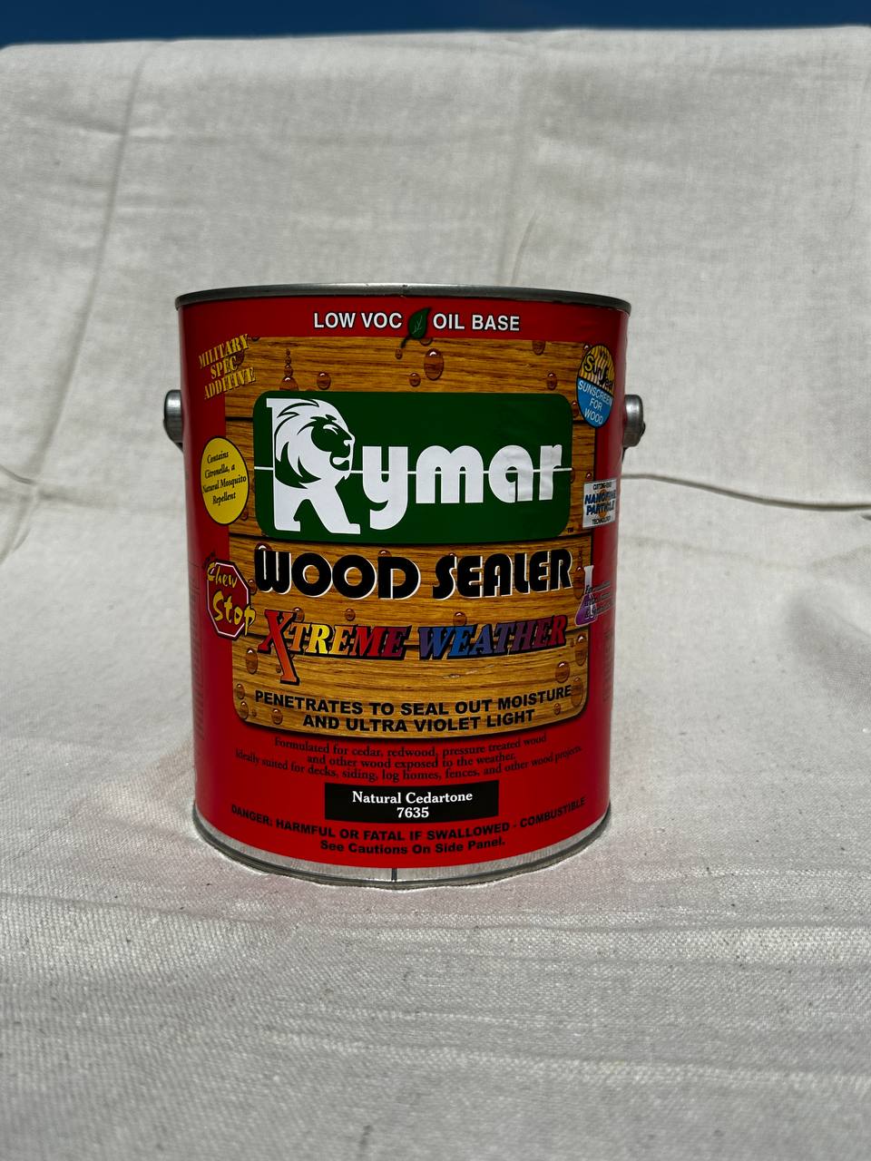 Gallon can of Rymar Xtreme Weather oil-based wood sealer in Natural Cedartone