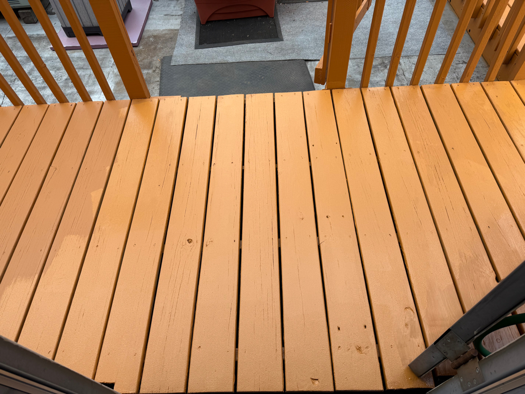 Freshly stained deck finished in a warm cedar tone