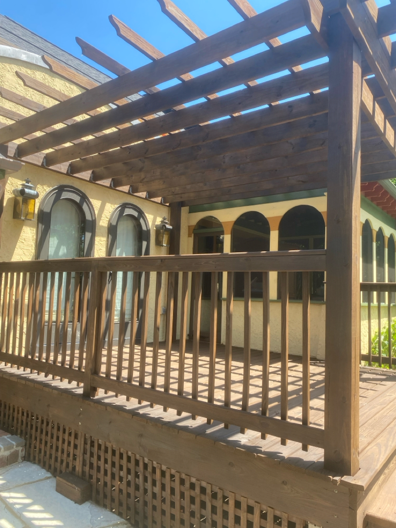 Freshly stained pergola and deck finished with a warm semi-transparent oil