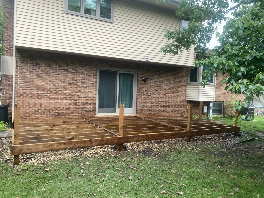 Freshly resurfaced and stained deck showing rich grain